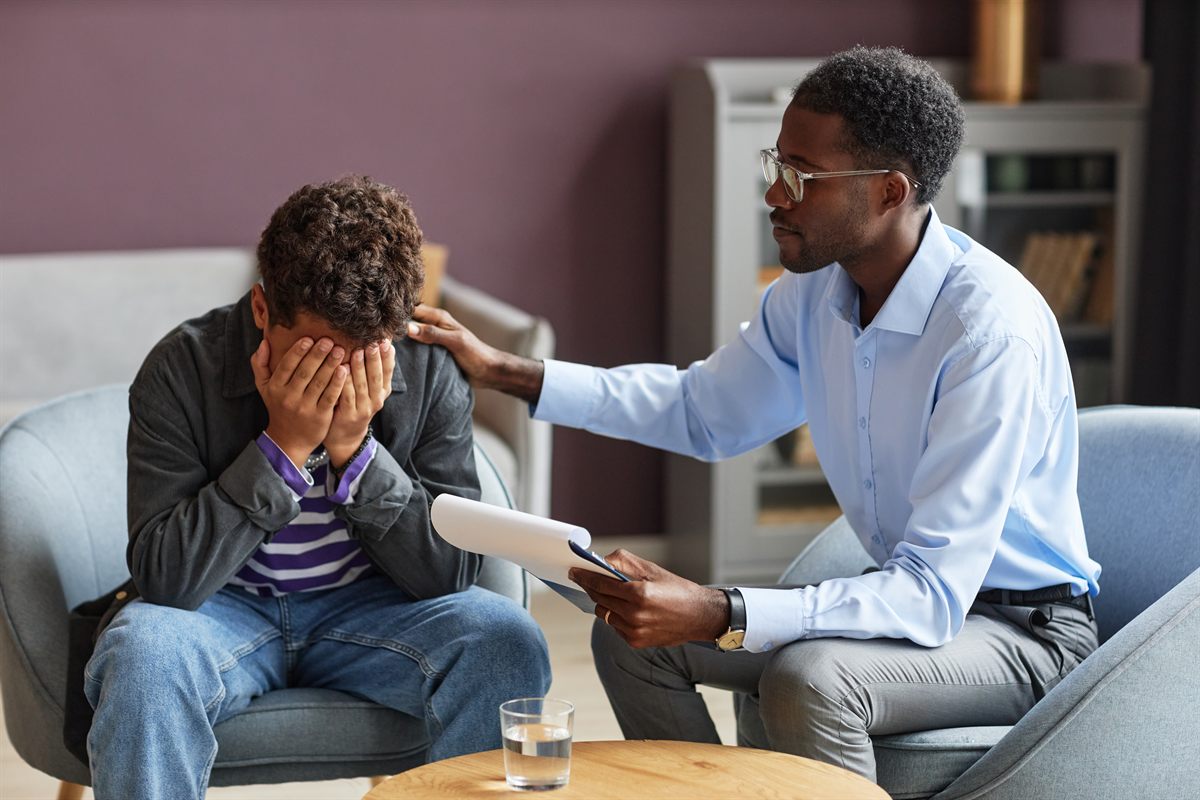 A counselor meeting with a young person