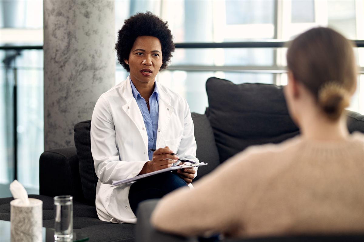 A therapist talking with a client